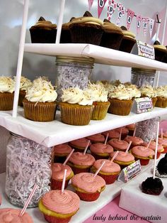 cupcakes and other pastries are on display