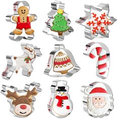 twelve christmas cookie cutters with different designs