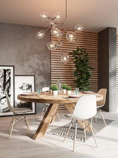 a dining room table with white chairs and a light fixture hanging from it's ceiling