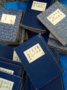 many blue folders with writing on them