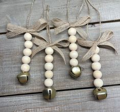 two bells are attached to some string on a wooden table