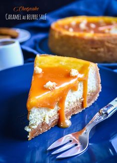 a piece of cheesecake on a blue plate with a fork next to the pie