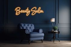 a blue chair sitting in front of a wall with the words beauty salon on it