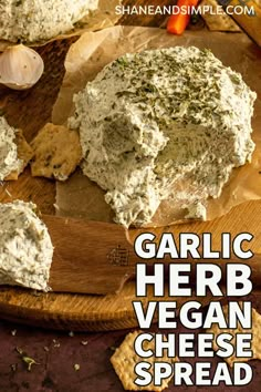 garlic herb vegan cheese spread on a wooden cutting board with text overlay that reads garlic herb vegan cheese spread