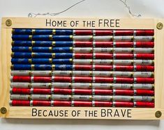 an american flag made out of crayons with the words, home of the free because of the brave