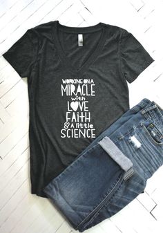 a t - shirt that says marriage is a miracle and the earth has science on it