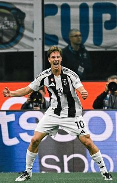 a soccer player is celebrating his goal on the field