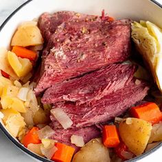 corned beef, potatoes and carrots in a pot