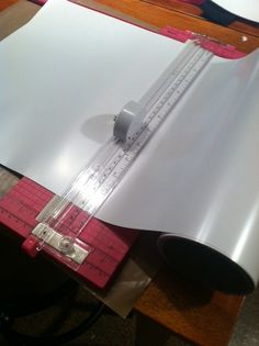 a piece of paper with a ruler on top of it