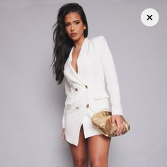 A Blazer Dress Is Everything We Are Loving For Your New Season Wardrobe And This One Is Sure To Be At The Top Of Your Hitlist. Featuring A White Material With An Asymmetric Design And Gold Button Detailing, We Are Obsessed. This Tuxedo Dress Is The Perfect Must-Have Wardrobe Piece You Can Wear From Season To Season, Add To Bag Doll! Just Style With Gold Heels And Accessories For The Ultimate Weekend-Ready Vibe That Is Sure To Have All Eyes On You Size 8 (M) Runs Big, Fits Like A Large Original P Chic V-neck Single Breasted Mini Dress, Fitted Blazer Dress With Button Closure For Party, Chic Double-breasted Blazer Dress For Date Night, Dressy Mini Dress For Office, Feminine Button-up Dress For Date Night, Single Breasted Mini Dress For Party, White Buttoned Knee-length Mini Dress, White Knee-length Mini Dress With Buttons, Single Breasted V-neck Mini Dress For Party