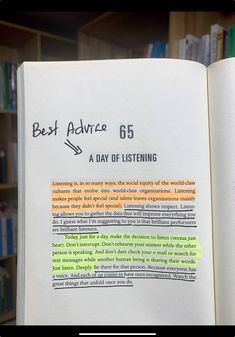 an open book with writing on it in front of a bookshelf full of books