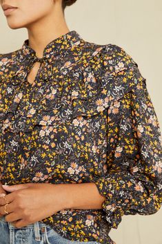 Mock neck blouse with tie detail 3/4 length puff sleeve Relaxed fit, double ruffle yoke Model is 5'8" and wears size Small. Floral Blouse Outfit, Fall Blouses, Cropped Flare Pants, Fall Blouse, Mock Neck Blouse, Cropped Flares, Floral Color, Blouse Outfit, Silk Skirt