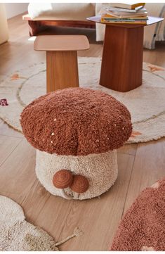 a mushroom shaped stool is on the floor