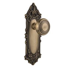 an antique style door handle on a white background