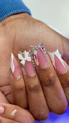 a woman's hand with pink and white nails