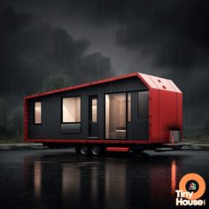 a red and black tiny house sitting in the rain