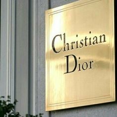 the christian dior sign is on the side of a building