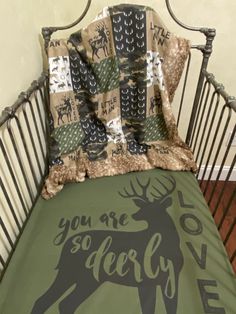 there is a bed with a deer on it and the words you are so dearly