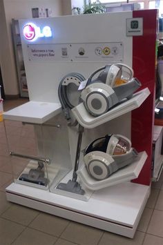 a display in a store with headphones on it's sides and an electronic device attached to the side