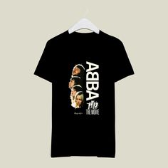 a black t - shirt with the words abra and three different faces on it