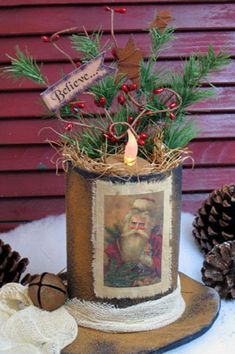 a christmas decoration with pine cones and other decorations