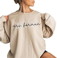 [Introduction] This classic crewneck sweatshirt features ribbing on the collar, hem, and cuffs to keep you warm. Double-needle stitched neckline, bottom hem, and sleeves shirt. Package includes 1 sweatshirt. [Gift perfect] Looking for the perfect sweater for your loved ones? Look no further! This awesome Custom Sweatshirt is a comfortable, affordable way to express yourself. Whether purchasing for anyone you can be sure to put a smile on their face [Customization] You can easily make your own sh Bridal Party Sweat Suits, Bridesmaid Sweatsuit, Bride And Groom Reception Outfit, Bridesmaid Sweatshirts, Bride Sweats, Bridal Apparel, Wifey Sweatshirt, Mrs Sweatshirt, Reception Outfit