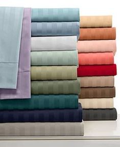 the sheets are neatly folded and ready to be placed on top of each other in different colors