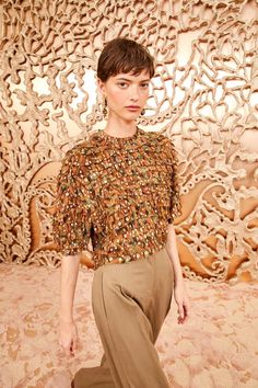 Visually stunning, our Carmella Blouse is made from crinkle chiffon that flickers with lurex dots woven into the fabric, bringing a gilded touch to the swirling, gold and brown paisley print beneath. This short-sleeve style has a round neckline and a relaxed fit that’s exquisitely tiered and ruffled throughout. It fastens with a center-back zipper.

 

Composition: 92% Silk, 8% Metallized Polyester Luxury Gold Short Sleeve Tops, Chic Short Sleeve Sequined Blouse, Brown Silk Party Tops, Party Brown Silk Tops, Fall Sequined Short Sleeve Blouse, Fall Sequin Short Sleeve Blouse, Chic Gold Short Sleeve Blouse, Glamorous Short Sleeve Blouse For Fall, Silk Ruffled Short Sleeve Top