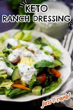 a white plate topped with a salad covered in ranch dressing