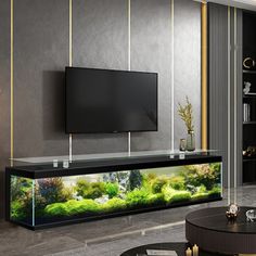 a living room filled with furniture and a flat screen tv on top of a wall