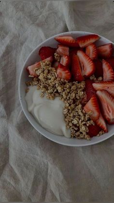 strawberries and yogurt in a white bowl