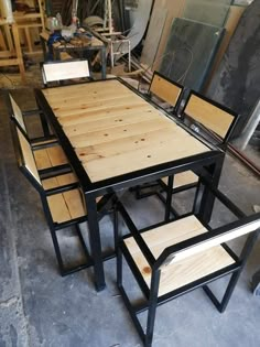 a table and chairs made out of plywood