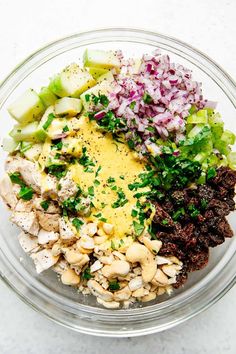 a glass bowl filled with different types of food