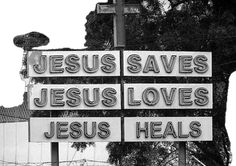 a street sign that says jesus saves, jesus loves, and jesus heals on it