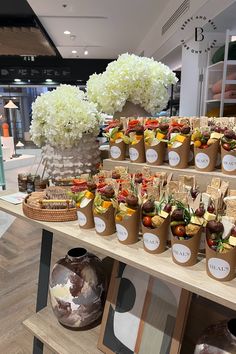 there are many different types of food on the shelves in this store that is decorated with flowers