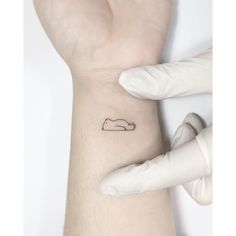 a person with a small tattoo on their arm