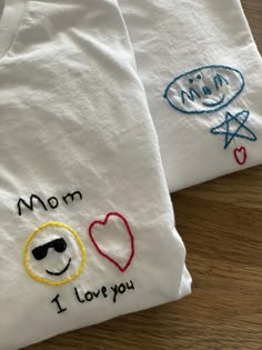 two t - shirts with embroidered designs on them that say mom, i love you