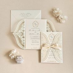 the wedding stationery is laid out on the table