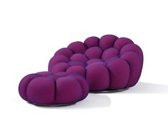 two purple cushions sitting on top of each other