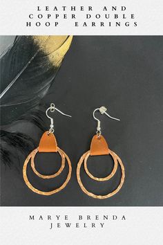 Leather and hammered copper double hoops add sophistication and fun to your casual wardrobe. Crafted from pure copper and finished with a beautiful brown leather strap is both lightweight and stylish. You will love the way these double hoop earrings turn and sparkle with its hand hammered hoop details. Perfect Bohemian style and a 3rd anniversary gift. The Minerva Smooth Veg Tanned Leather gives the earrings that soft classic look. Buying as a gift? Gift Bag included! Double Hoop Earrings, Brown Leather Strap, Hammered Copper, Pure Copper