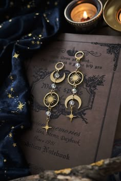 * Stunning mismatched statement earrings 🖤 These stainless steel Moon and Stars earrings will give your outfit an instant witchy, mystical touch. * Stainless steel! * The total length of the earrings is approximately 9 cm (aprox 3.5 inches), hook included.  * They come in a pretty little pouch 🖤 *Matching necklace available here: https://www.etsy.com/listing/1737218251/celestial-choker-necklace-witchy-moon Earrings Matching, Celestial Jewelry Aesthetic, Whimsigothic Jewelry, Celestial Style Earrings As Gift, Handmade Celestial Metal Earrings, Witchy Accessories, Celestial Earrings, Handmade Celestial Dangle Earrings, Mystical Dangle Earrings