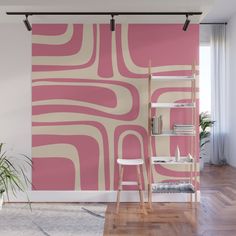 a living room with pink and white wallpaper