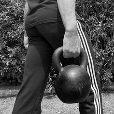 a man holding a kettle in his right hand