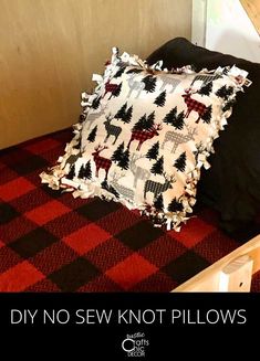 a black and white pillow sitting on top of a red checkered floor next to a window