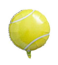 a yellow tennis ball shaped balloon with white string on the bottom and sides, flying in the air