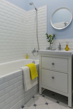 a bathroom with a sink, mirror and bathtub in the middle of it is featured on instagram