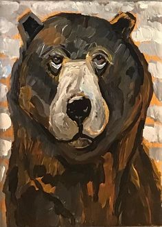 a painting of a brown bear on a white brick wall with orange and black stripes