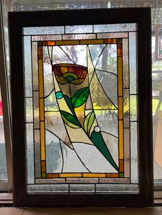 a stained glass window with a flower on it