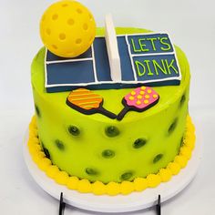 a tennis themed cake on a white plate