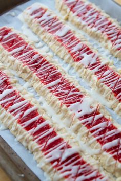 red, white and blue candy sticks are on a baking sheet